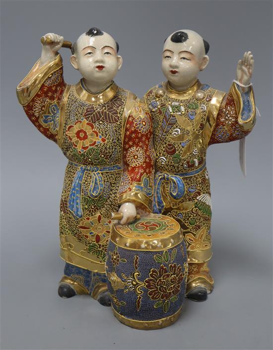 A Satsuma pottery group of two boys drumming, height 28cm